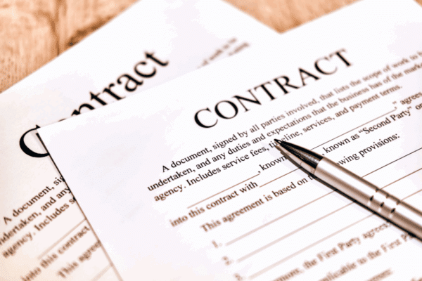 Paper contract with pen
